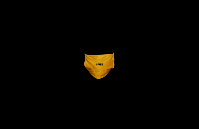 Yellow face mask with #FREE text