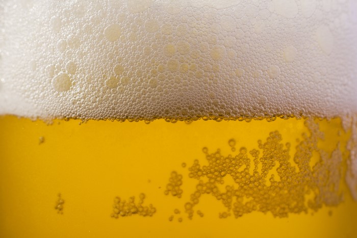 Close-up of beer with foam and bubbles