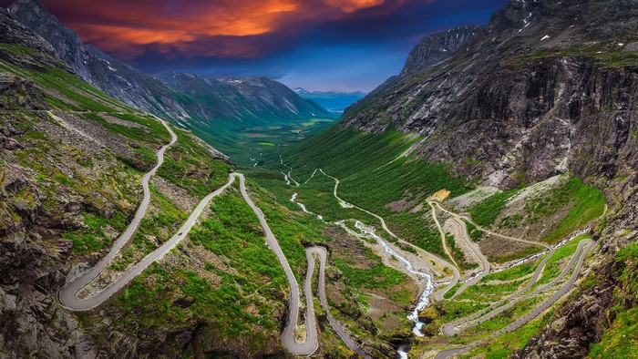 Trollstigen road winding through a Norwegian valley