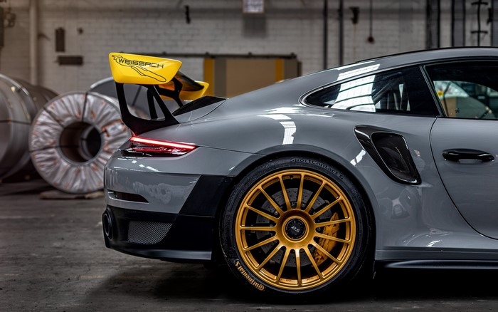 Grey Porsche 911 GT2 RS Weissach with gold wheels