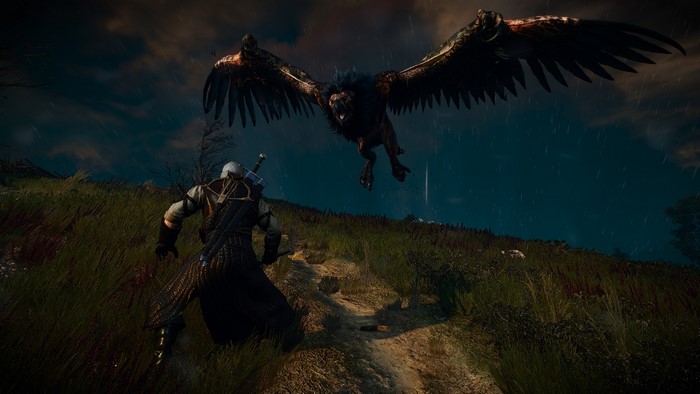 Geralt of Rivia fighting a griffin in The Witcher 3