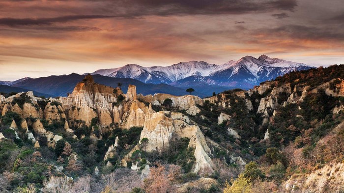 Rock formations and snow-capped mountains in France