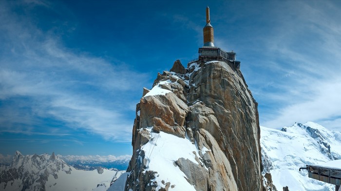 Aiguille du Midi peak with a structure on top in the Alps