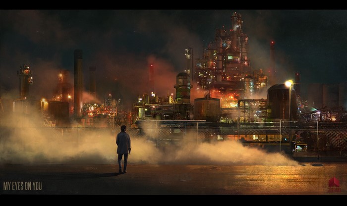 Man standing in front of industrial complex at night