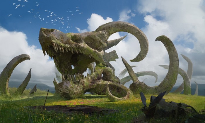 Giant creature skull and horns in a grassy field