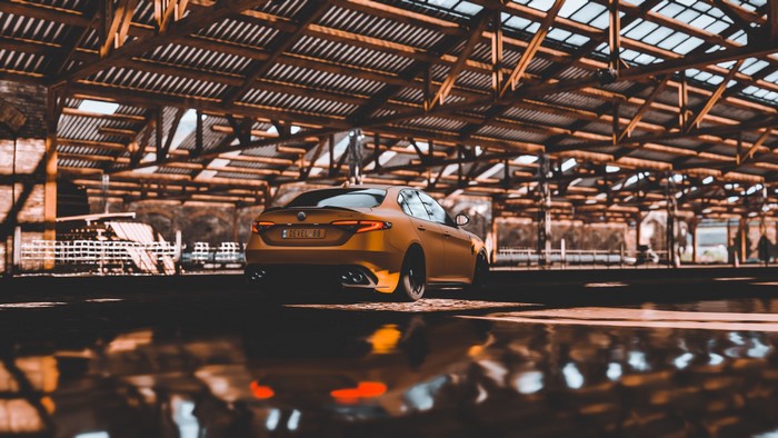 Yellow Alfa Romeo Giulia Quadrifoglio in a Barn