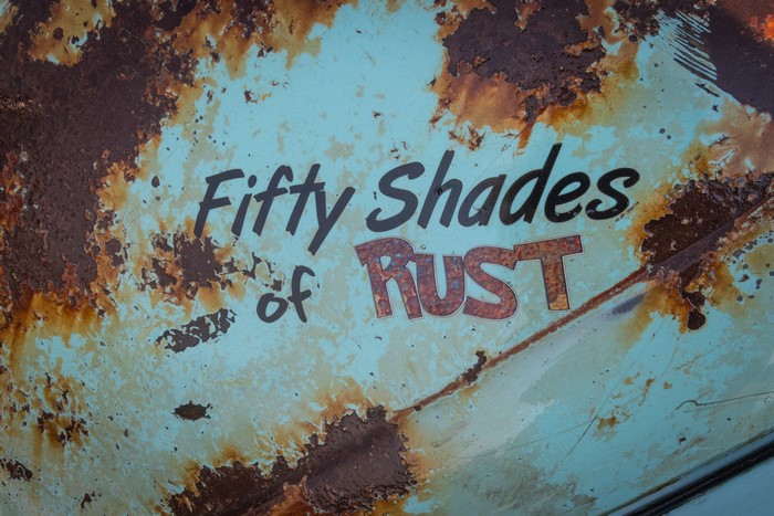 Fifty Shades of Rust text on metal