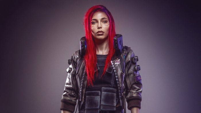 Woman in Cyberpunk 2077 cosplay with red hair