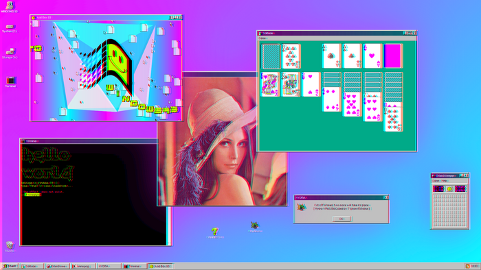 Windows 95 desktop with Solitaire and abstract art