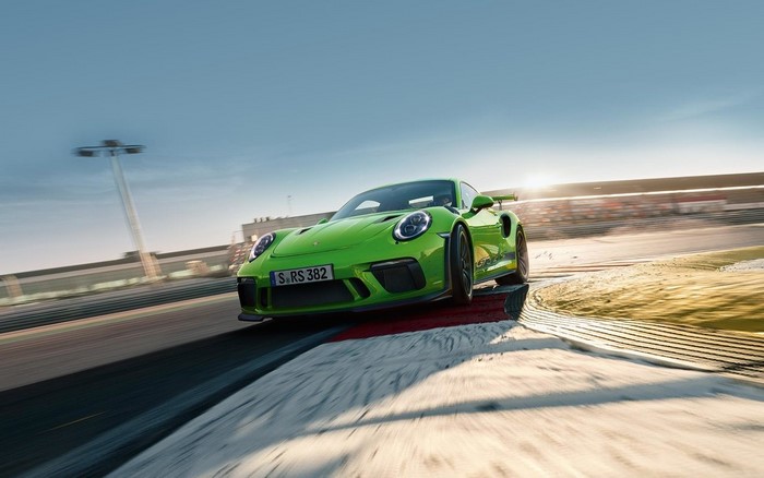 Green Porsche 911 GT2 RS on a race track