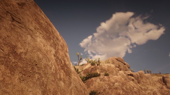 Red Dead Redemption 2 desert landscape with rocks and sky