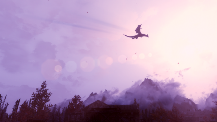 Dragon flying over mountains in Skyrim