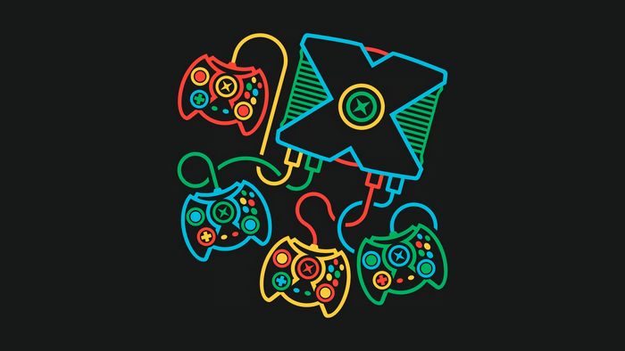Retro Xbox controllers connected to an Xbox console