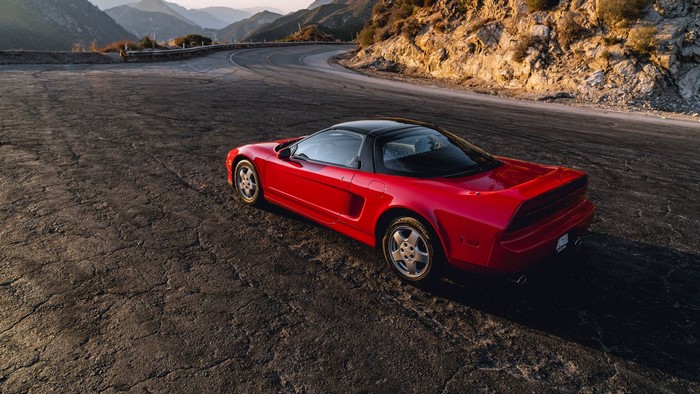 Red Acura NSX on a mountain road