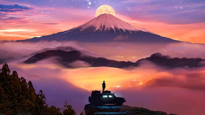 Man on SUV overlooking Mount Fuji with moon and stars