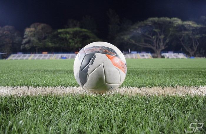 Soccer ball on a field at night