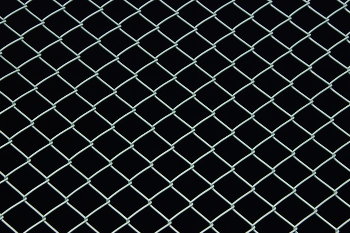 Chain-link fence at night