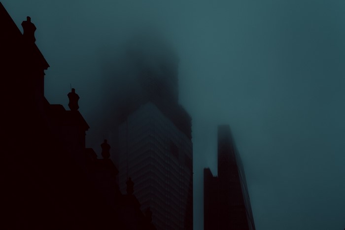 City skyscrapers shrouded in mist