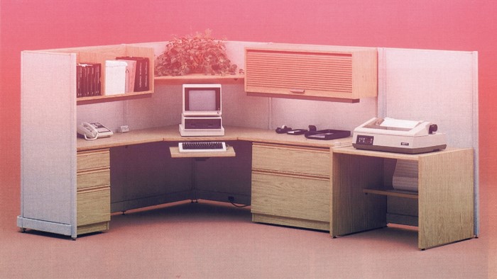 1980s office cubicle with computer and printer