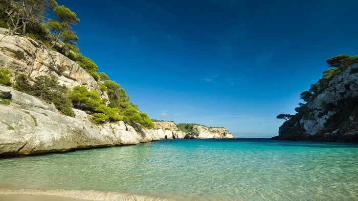 Clear turquoise water and rocky cliffs in Spain