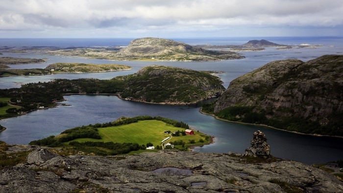 Rocky islands and coastline with houses in Norway