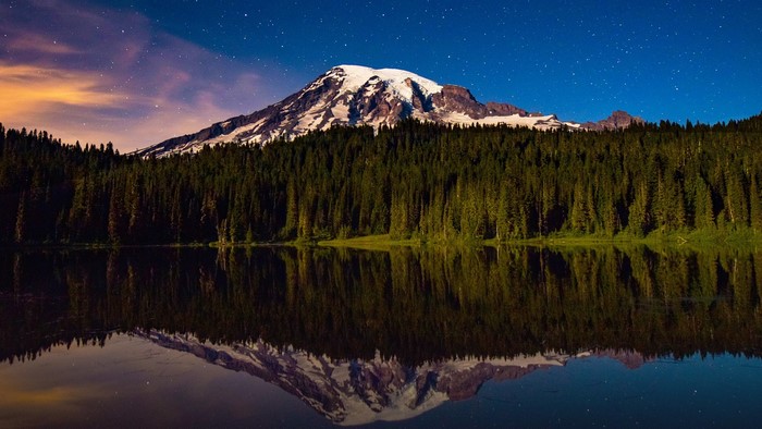 Mount Rainier reflected in a lake at night