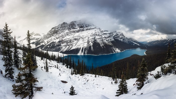 Snowy mountains and blue lake landscape