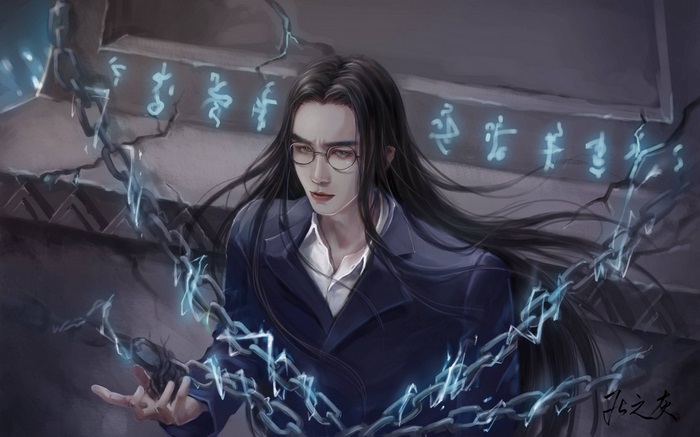 Man with long black hair and glasses