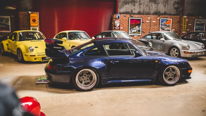 Porsche 911s in a garage