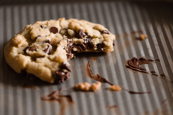 Chocolate chip cookie on a baking sheet
