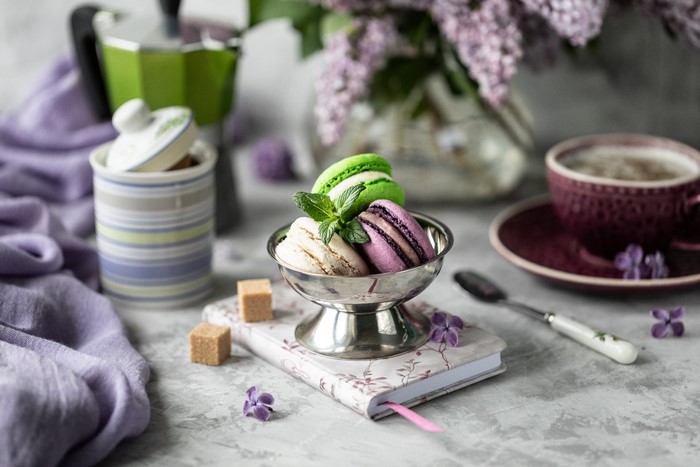 Macarons and coffee with lilacs