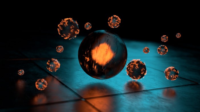 Dark spheres with orange glowing patterns on a cyan surface