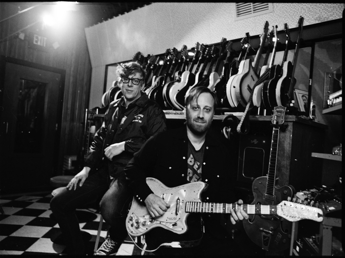 Patrick Carney and Dan Auerbach with guitars