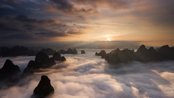 Sunrise over karst mountains in Guilin, China with sea of clouds