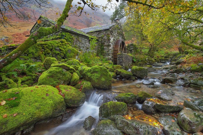 Moss-covered water mill in Cumbria, England
