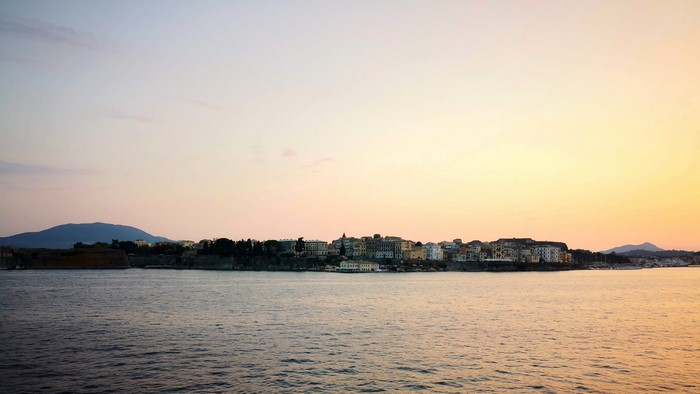 4K sunset over coastal city in Greece