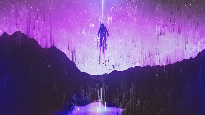 Silhouette of a person ascending a beam of light over mountains
