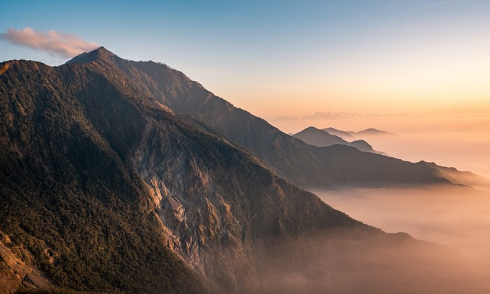 4K mountain landscape with mist at sunrise