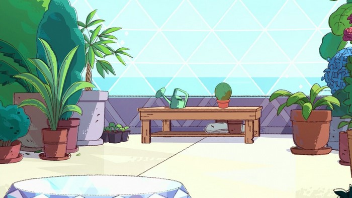 Greenhouse interior with plants and a table