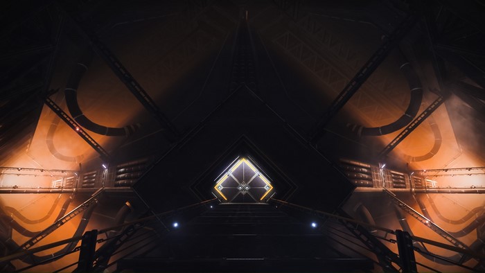 Interior of a dark, industrial structure with orange lighting