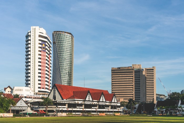 Kuala Lumpur City Skyline with Buildings and Malaysian Flag