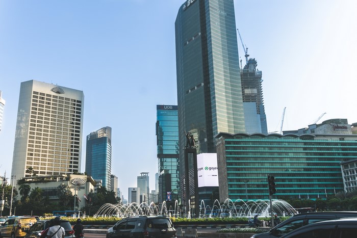Jakarta skyline with buildings and fountains