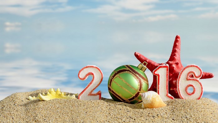 2016 Christmas ornaments on a beach