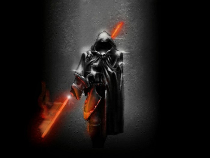 Hooded figure with glowing orange lightsaber