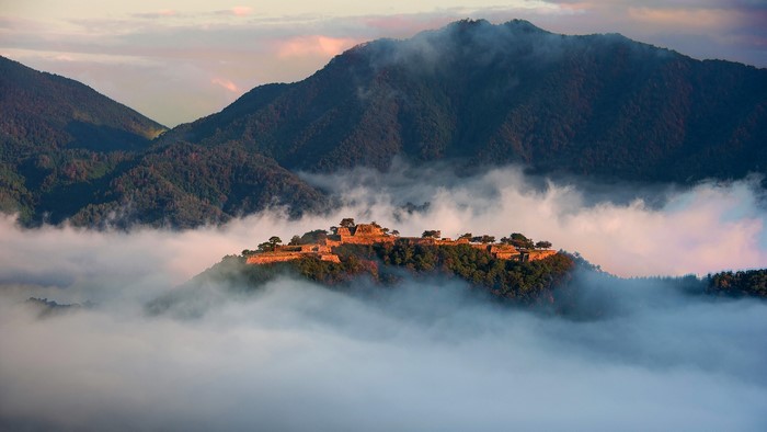 Takeda Castle Ruins in Japan surrounded by mist