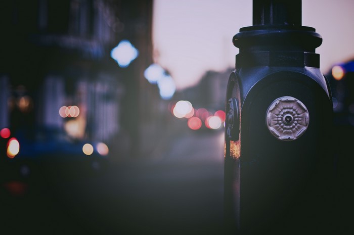 Street lamp with bokeh lights in the evening