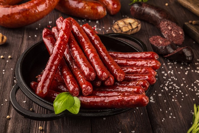 Sausages and blood sausage on a wooden table