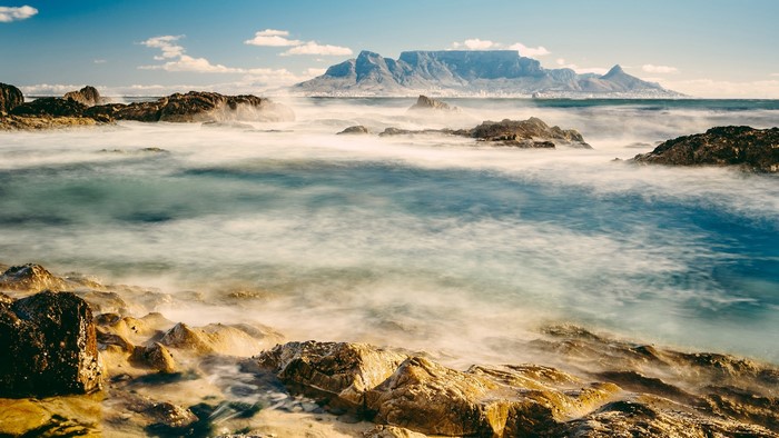 Table Mountain and ocean with rocks, long exposure
