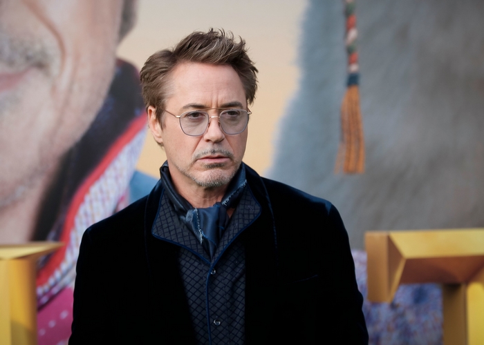 Robert Downey Jr. wearing glasses and a scarf