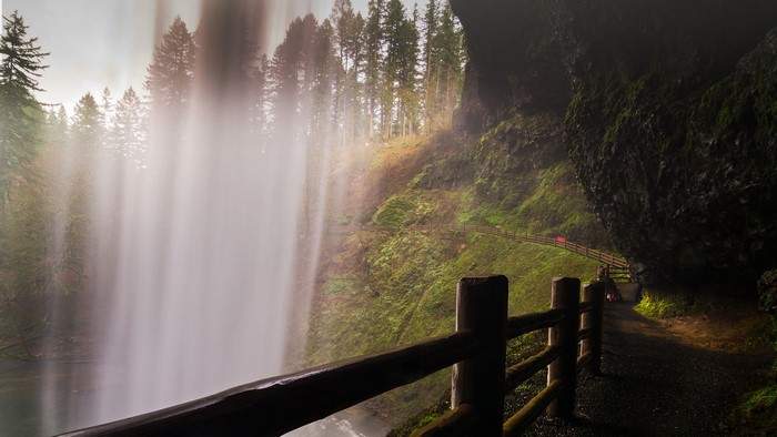 South Falls waterfall path with fence and mossy rocks